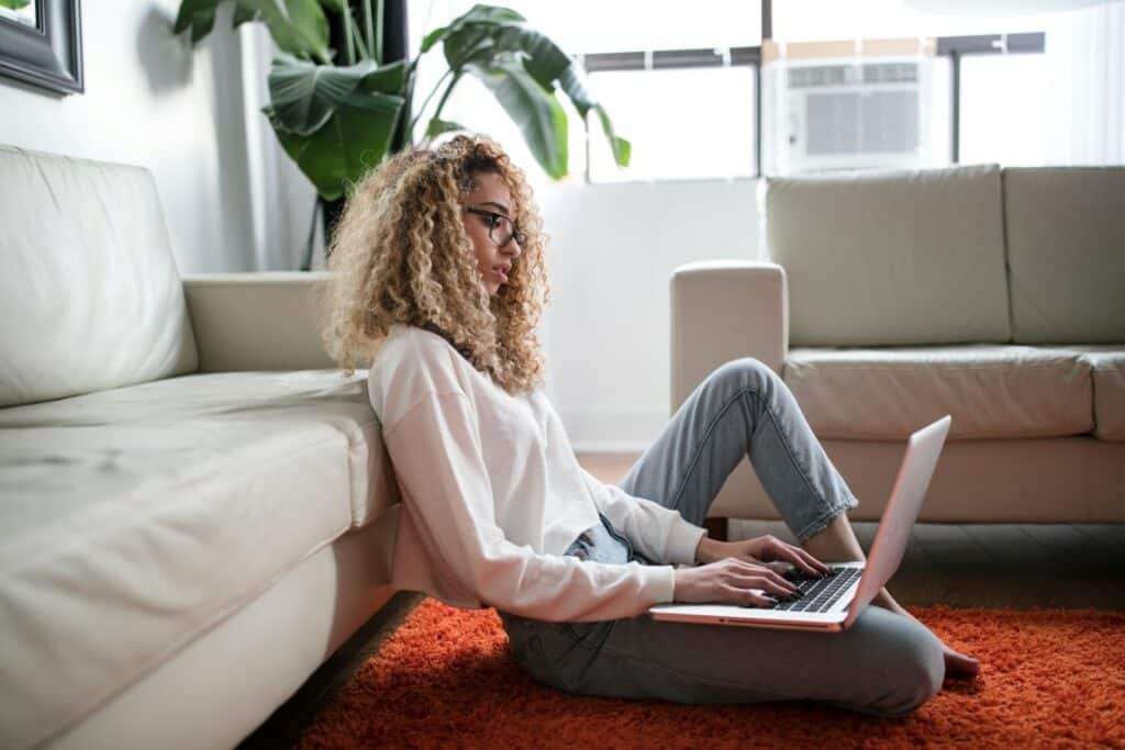woman researching housing on laptop